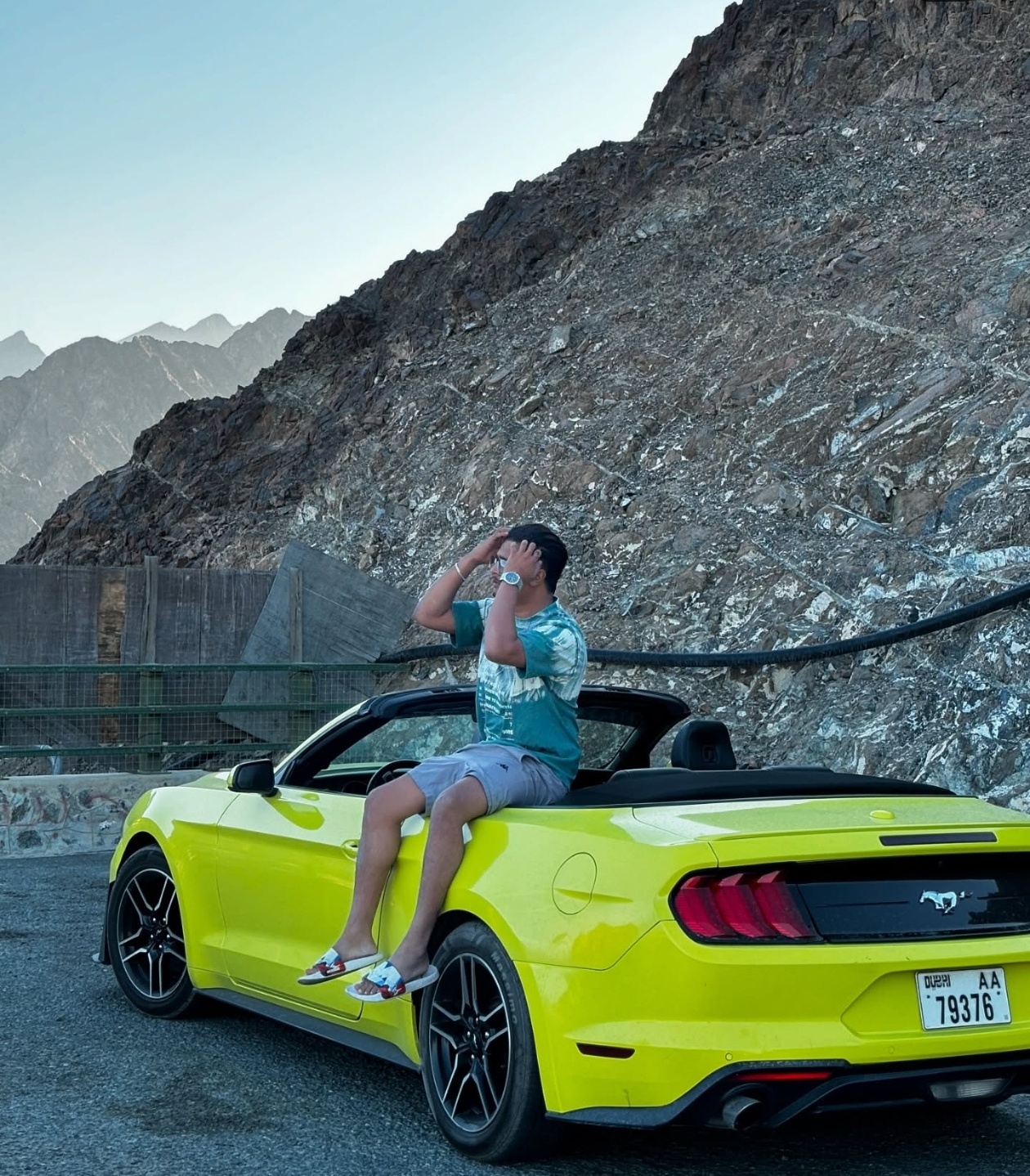 Afshan Afsal with a convertible in the UAE mountains